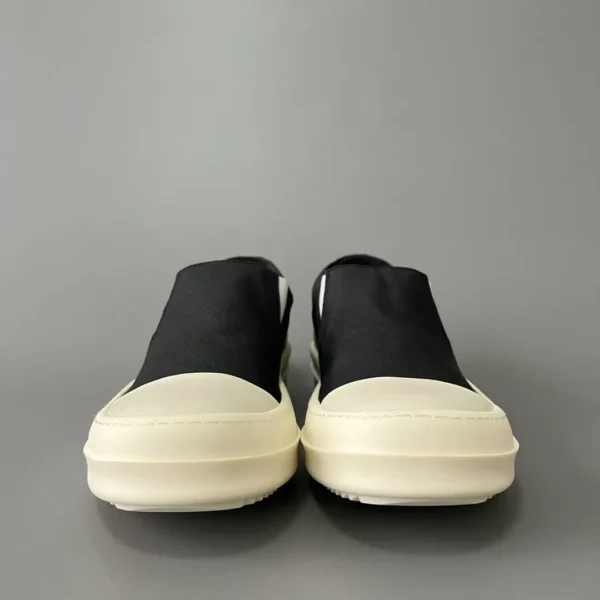 Rick Owens DRKSHDW old wax cloth kicks and covers his feet. - Image 2