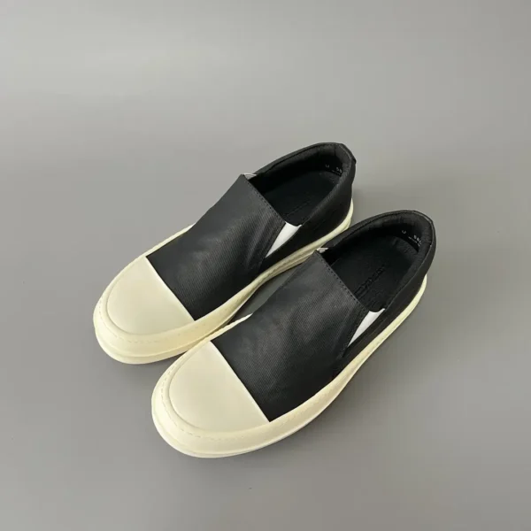 Rick Owens DRKSHDW old wax cloth kicks and covers his feet. - Image 8