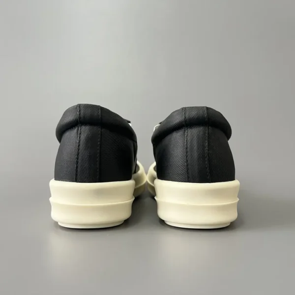 Rick Owens DRKSHDW old wax cloth kicks and covers his feet. - Image 5