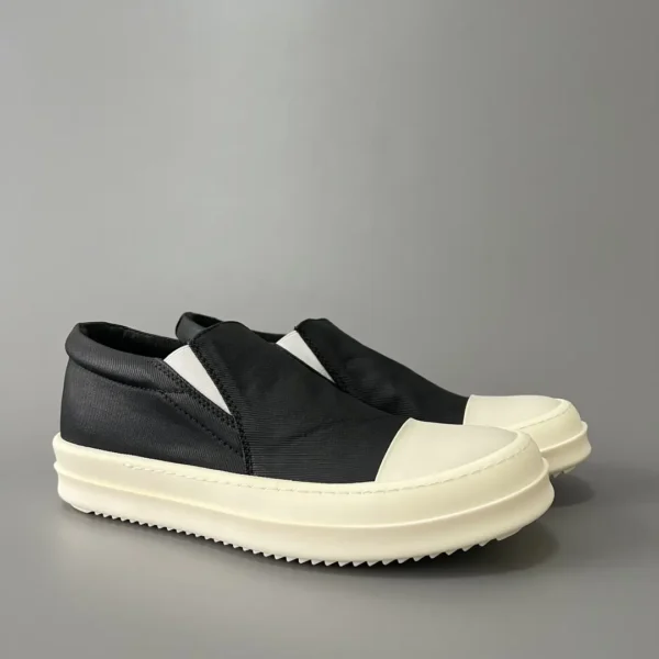 Rick Owens DRKSHDW old wax cloth kicks and covers his feet. - Image 3