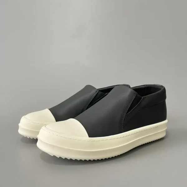 Rick Owens has a big white head and a big bump on his feet.
       
market