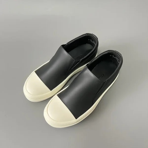 Rick Owens has a big white head and a big bump on his feet.
       
market - Image 8