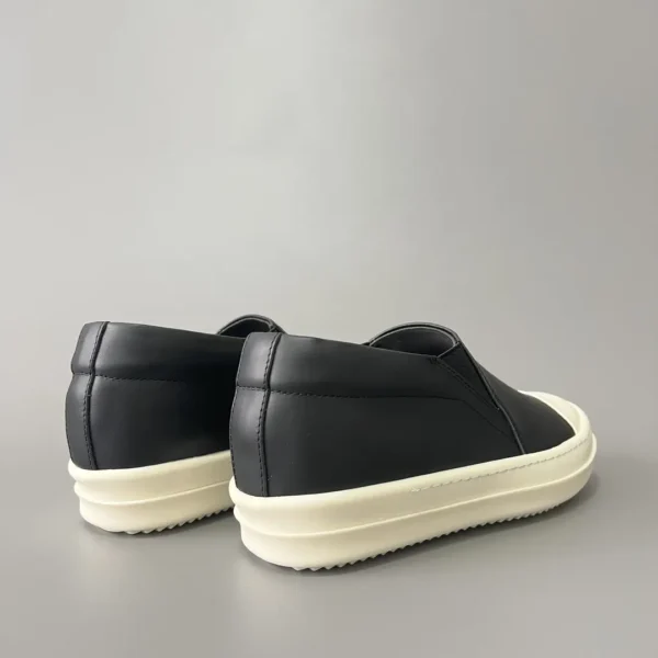 Rick Owens has a big white head and a big bump on his feet.
       
market - Image 4