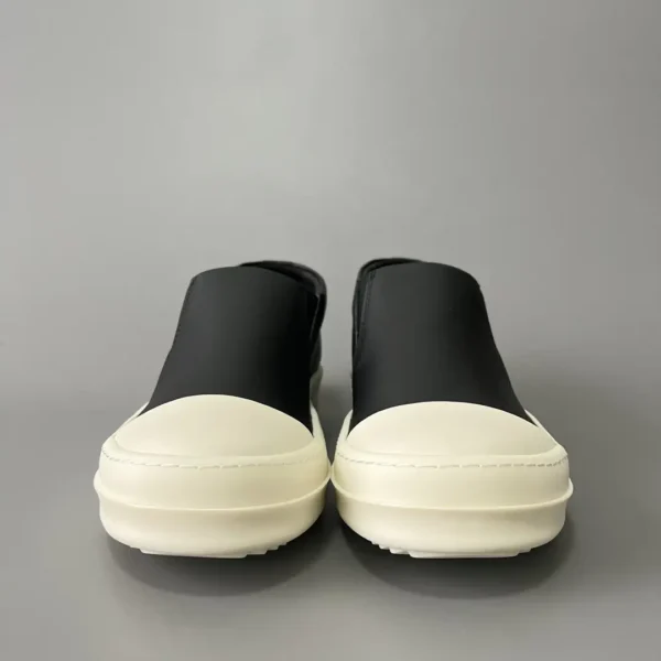 Rick Owens has a big white head and a big bump on his feet.
       
market - Image 2