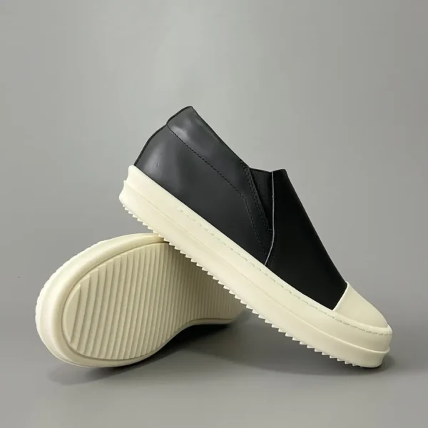 Rick Owens has a big white head and a big bump on his feet.
       
market - Image 7