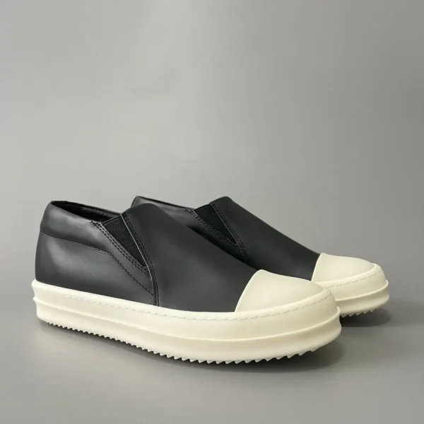 Rick Owens has a big white head and a big bump on his feet.
       
market - Image 3