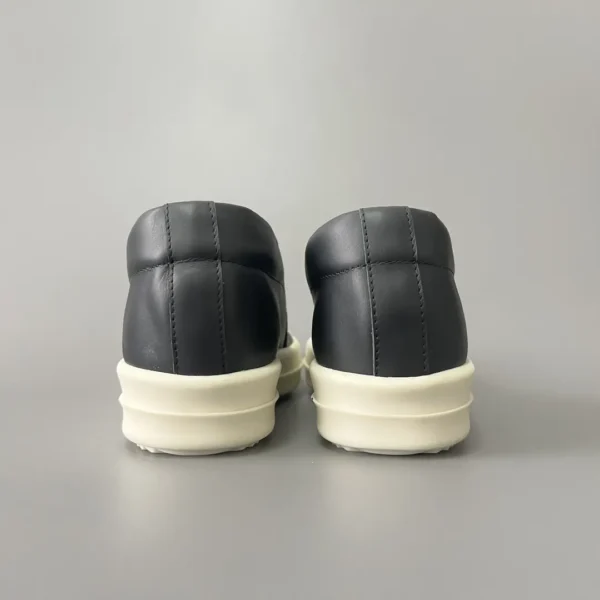 Rick Owens has a big white head and a big bump on his feet.
       
market - Image 5